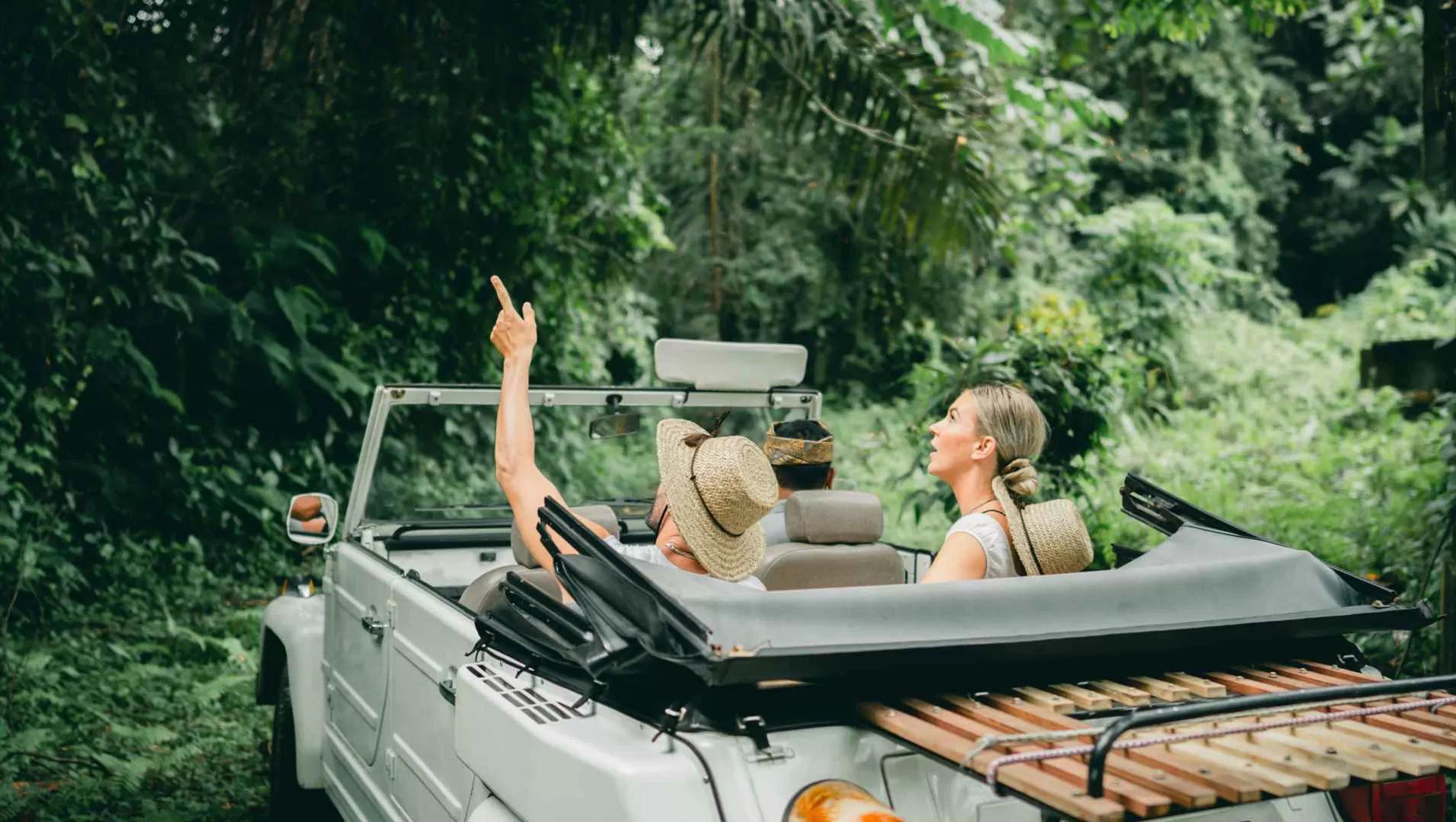 Vintage car drives jungle path of Balinese villages, Banyan Tree Escape - Buahan.